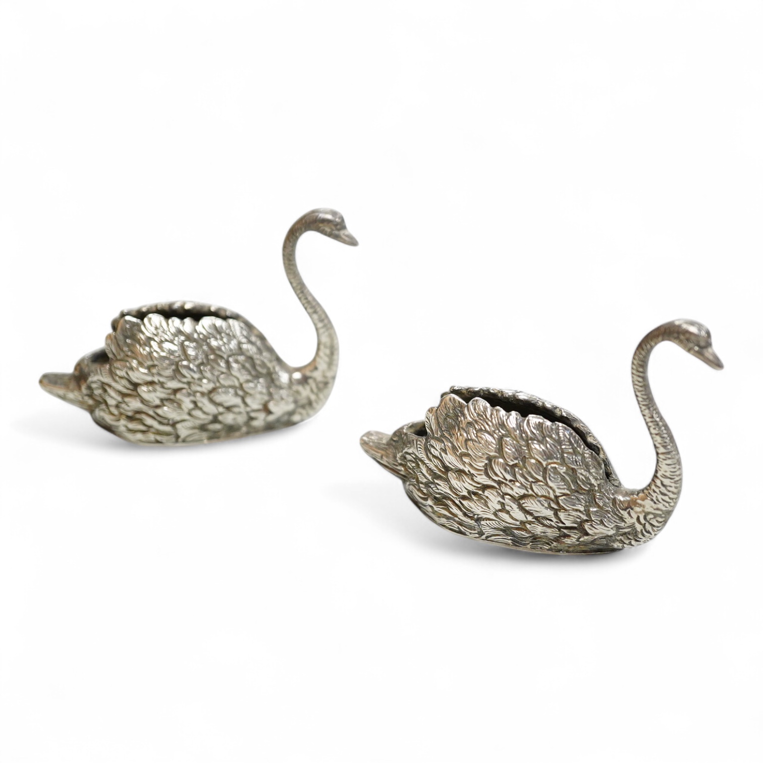A pair of modern silver swan menu holders, maker E.A.W., Birmingham, 1975, height 44mm.